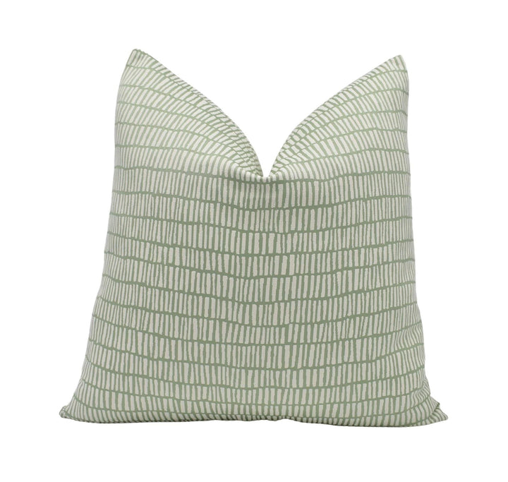 A single pillow with a repeating pattern of green and white stripes.
