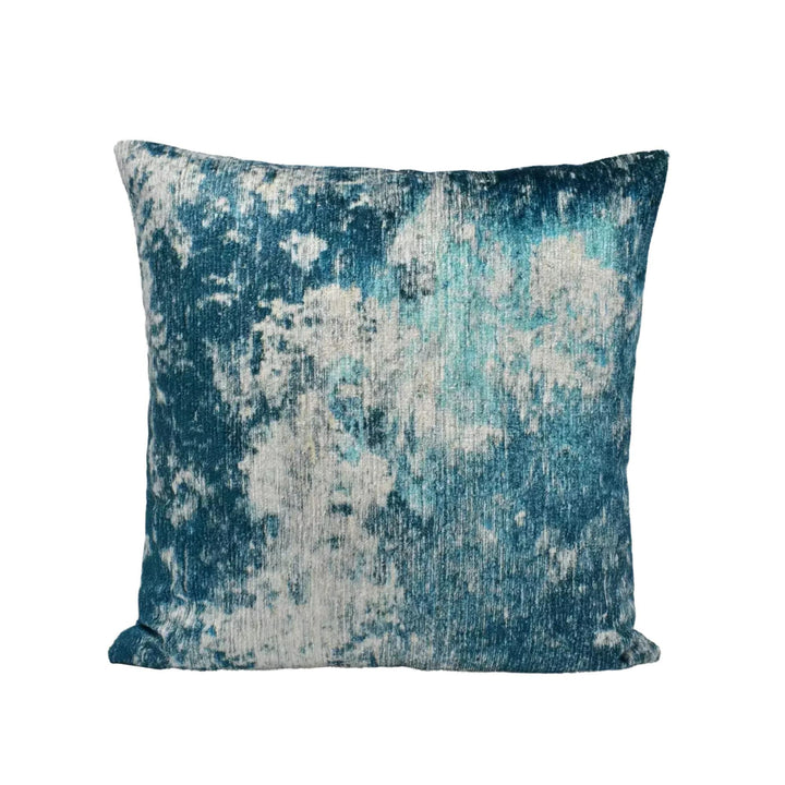 A square throw pillow with a textured blue and white pattern.
