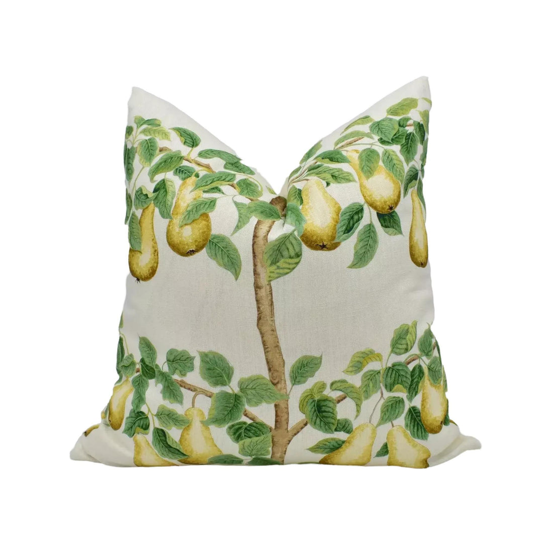 A white pillow with a design of green leaves and yellow pears on it.