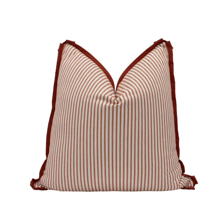A single pillow with a striped pattern in red and white colors.