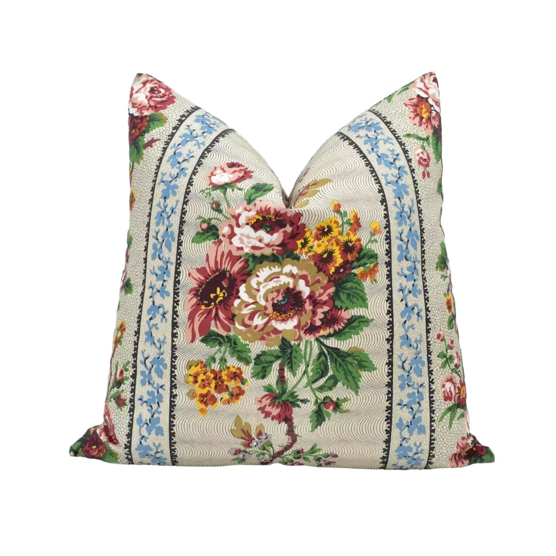 A decorative throw pillow with a floral print design.