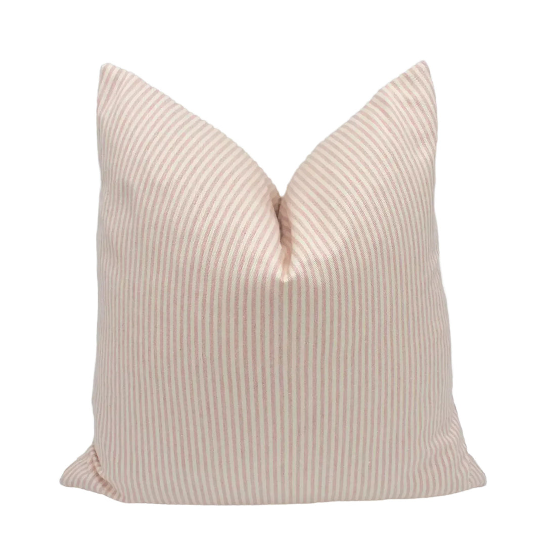 A single pillow with a striped pattern in shades of peach and white.