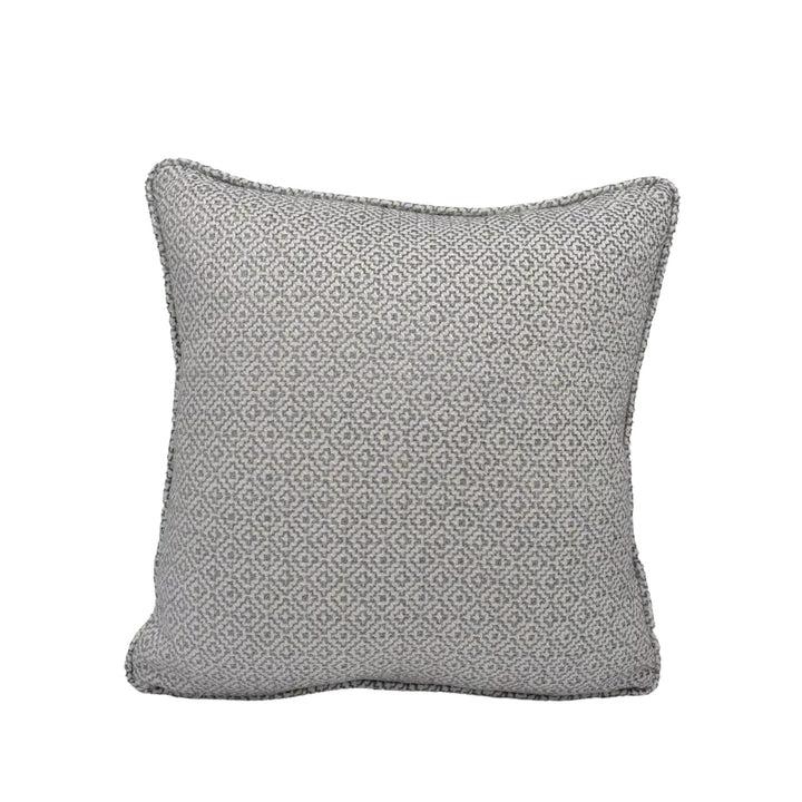 A gray throw pillow with a geometric pattern.
