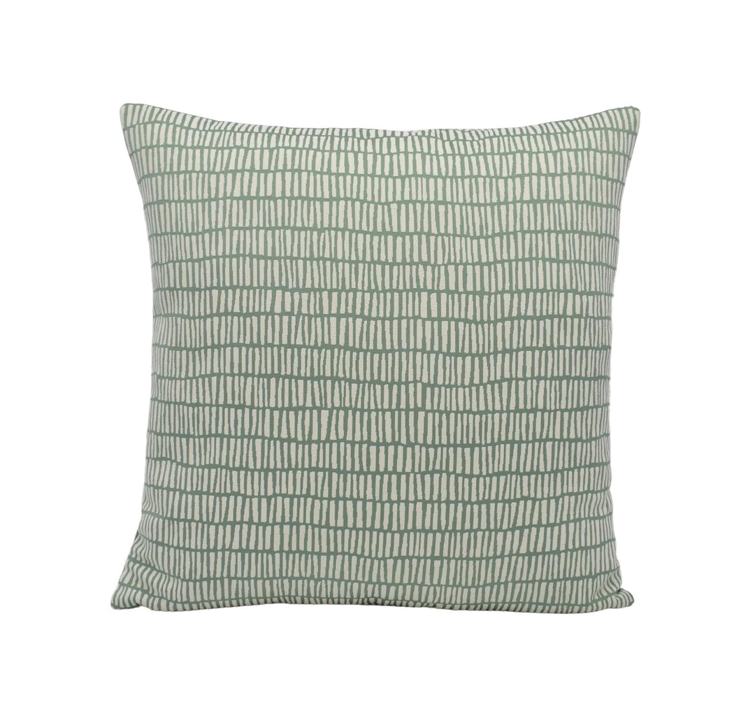 A square throw pillow with a repeating pattern of green and white vertical lines.