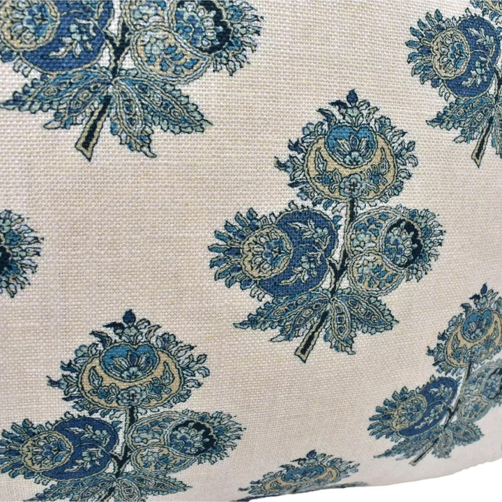 a close-up view of a fabric with a repeating pattern of blue and yellow flowers or leaves. The pattern is intricate and detailed, with each flower or leaf appearing in multiple locations across the fabric. The overall design is visually striking and eye-catching, with the contrasting colors of the blue and yellow flowers or leaves creating a sense of depth and dimension.