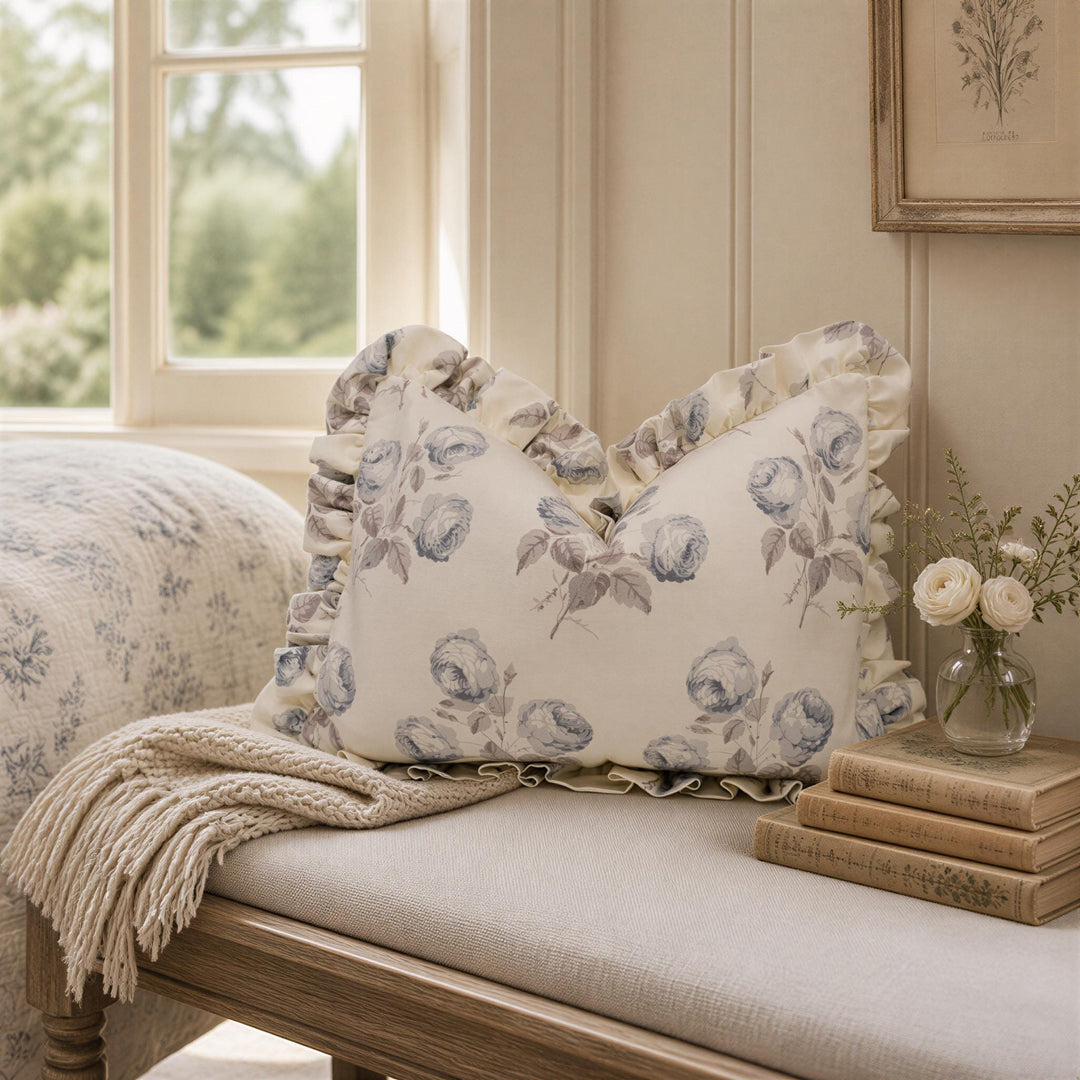 a pillow on a bench next to a window