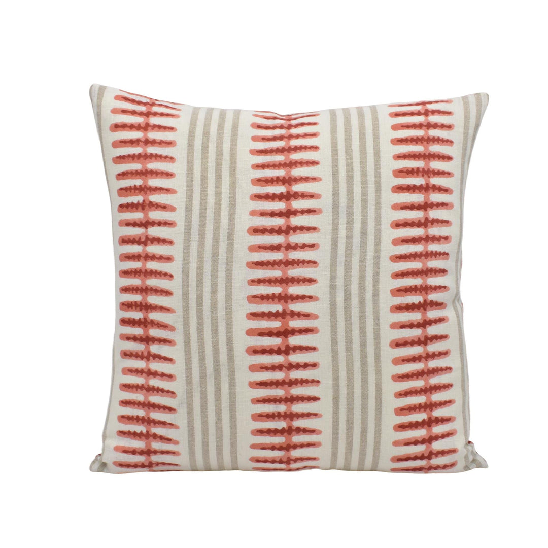 a square pillow with a striped pattern in shades of gray and red.