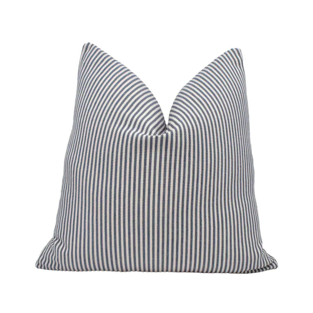 A single pillow with a striped pattern in shades of blue and white.