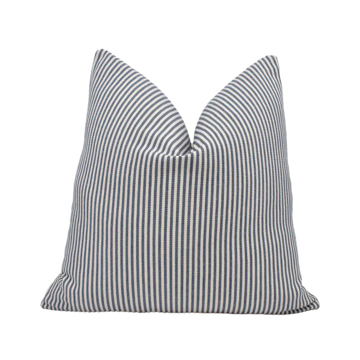 A single pillow with a striped pattern in shades of blue and white.