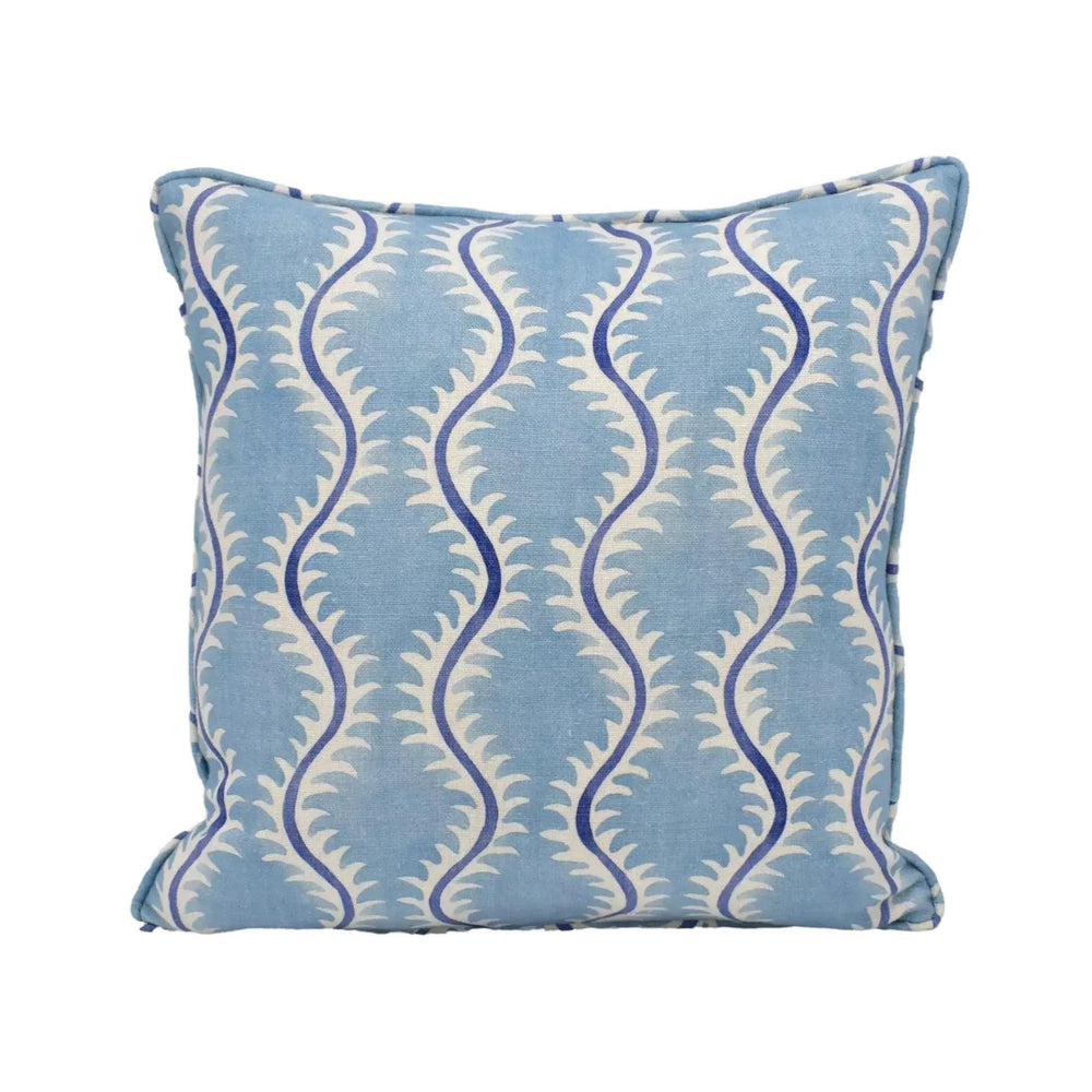A blue and white patterned throw pillow with a repeating design of blue and white swirls.