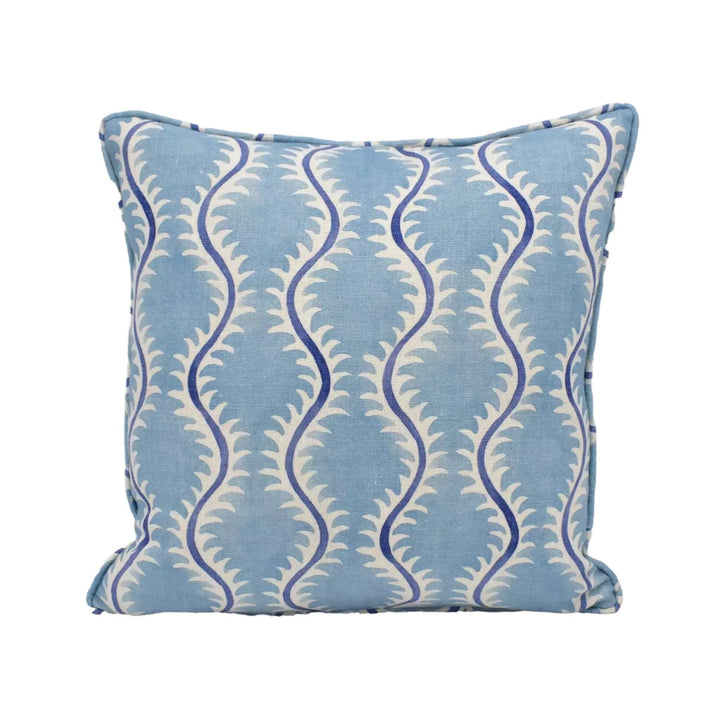A blue and white patterned throw pillow with a repeating design of blue and white swirls.