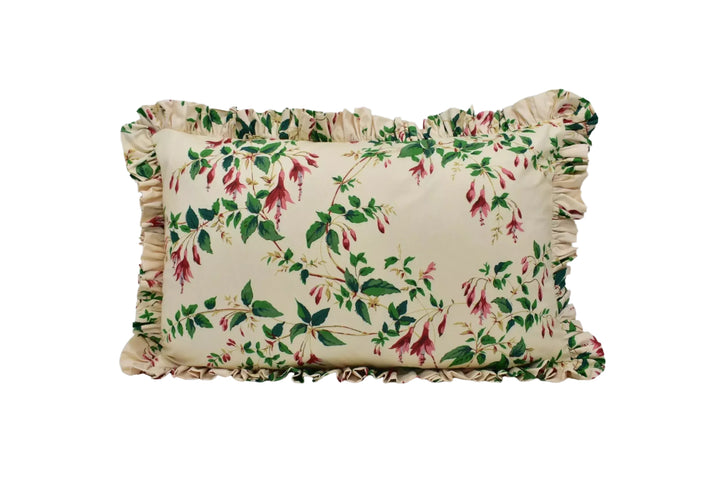 A decorative pillow with a floral print design on a beige background.