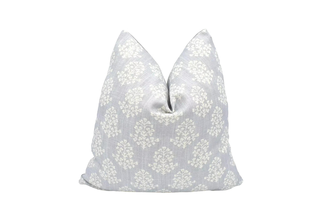 A gray and white patterned pillow is displayed against a white background.