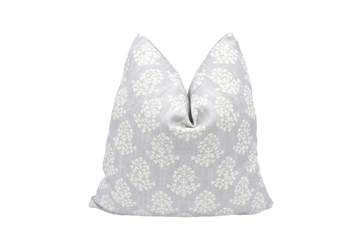 A gray and white patterned pillow is displayed against a white background.