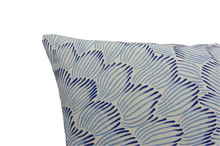 a close-up view of a decorative pillow with a blue and white striped pattern.