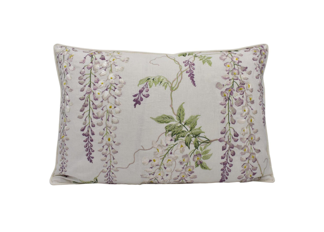 a white pillow with purple flowers on it