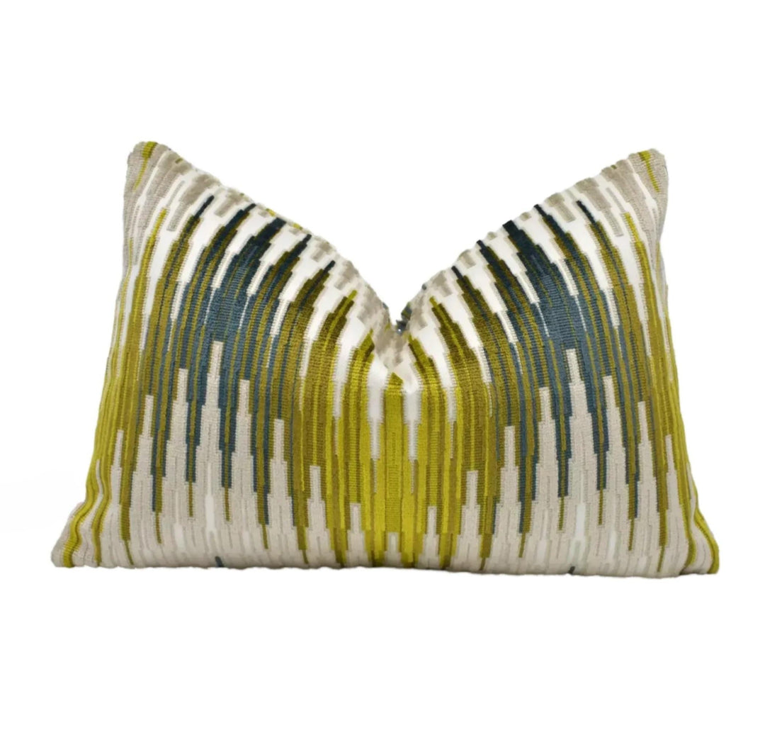 a single pillow with a vibrant, colorful design featuring vertical stripes in shades of green, yellow, and white.