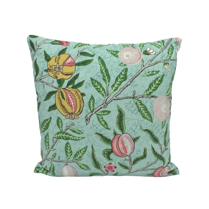A square throw pillow with a vibrant floral pattern in shades of green and pink, featuring pomegranate and leaf motifs.