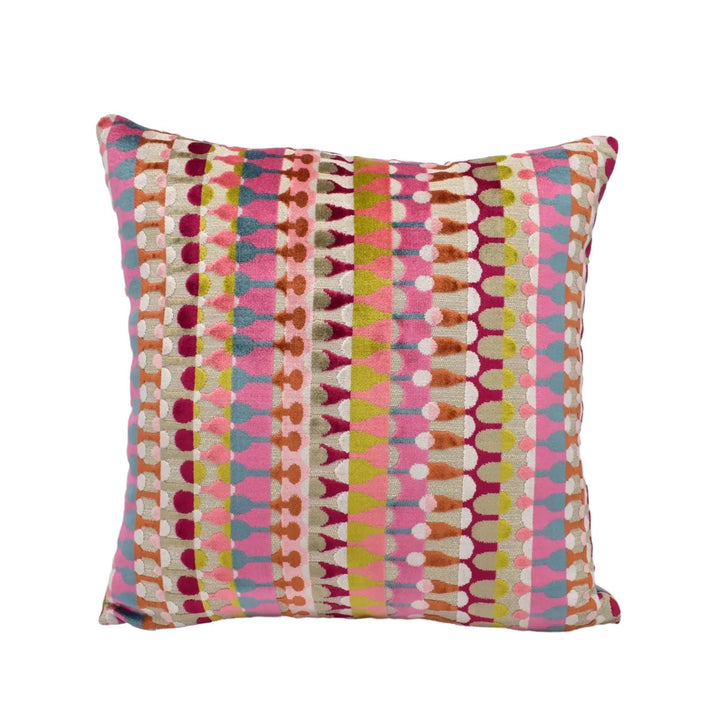 A square throw pillow with a vibrant, multicolored geometric pattern in shades of pink, orange, yellow, and green.