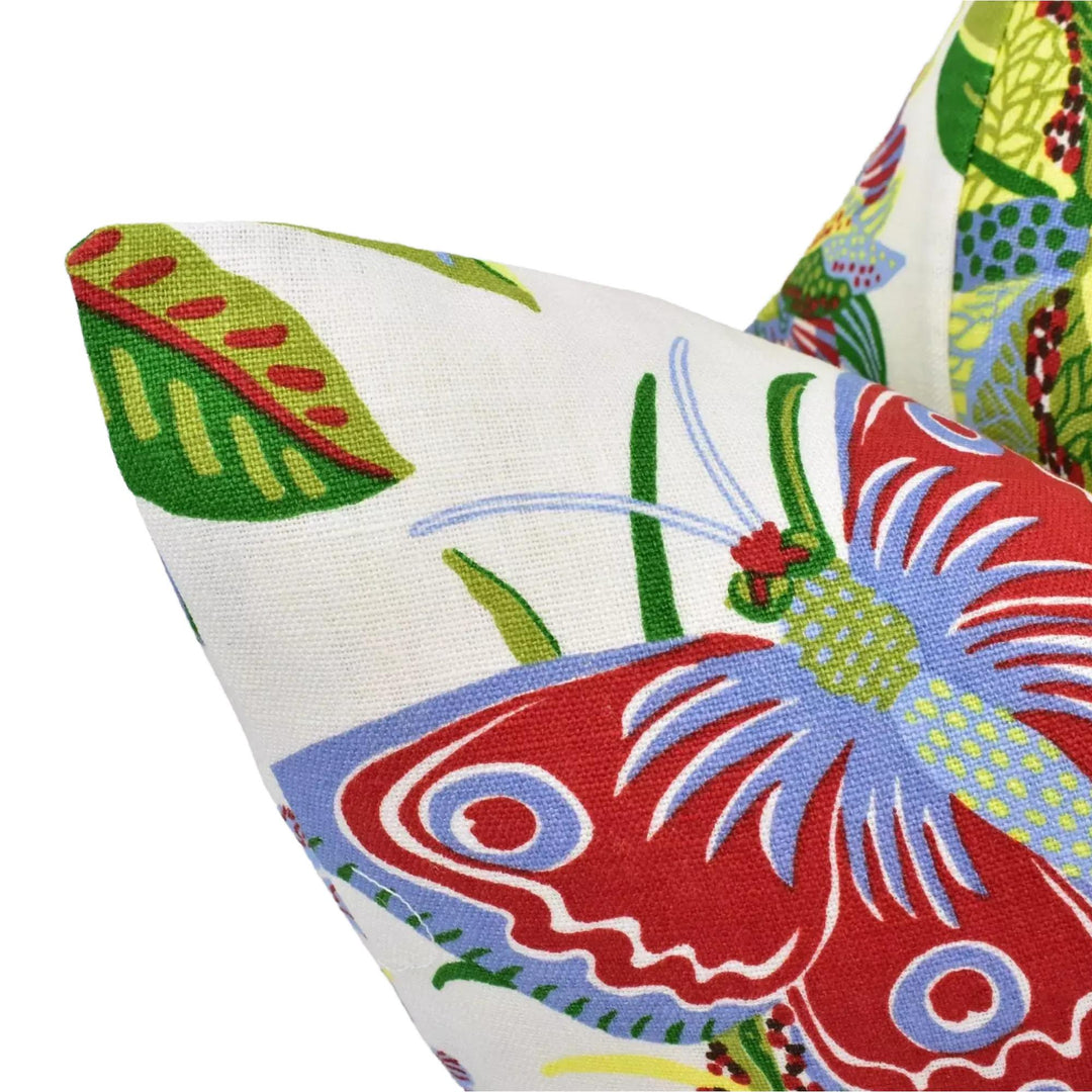 a close-up view of a colorful, patterned pillow with a butterfly design.