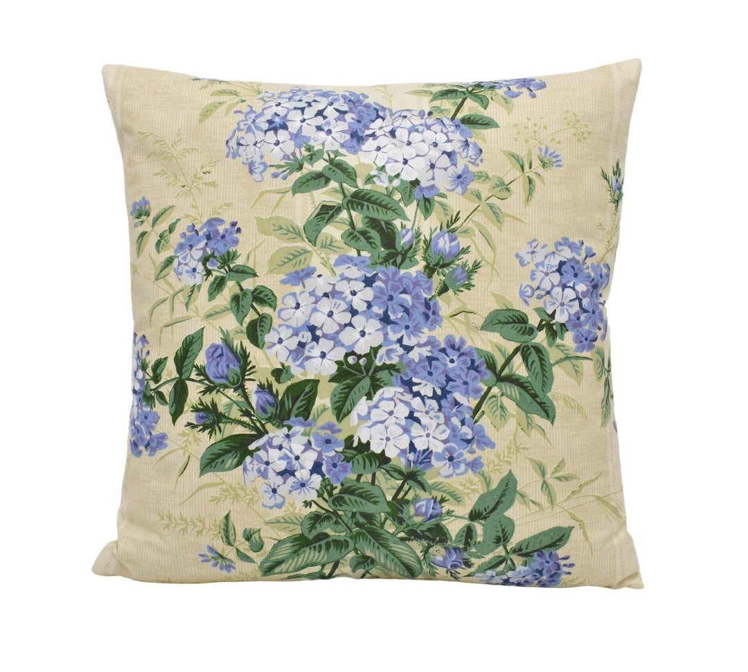 a pillow with blue flowers on it