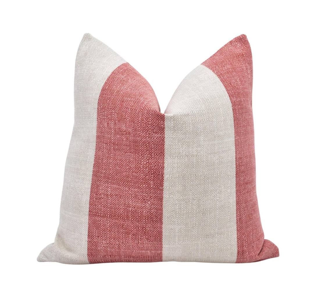 A single pillow with a striped pattern in red and white colors.
