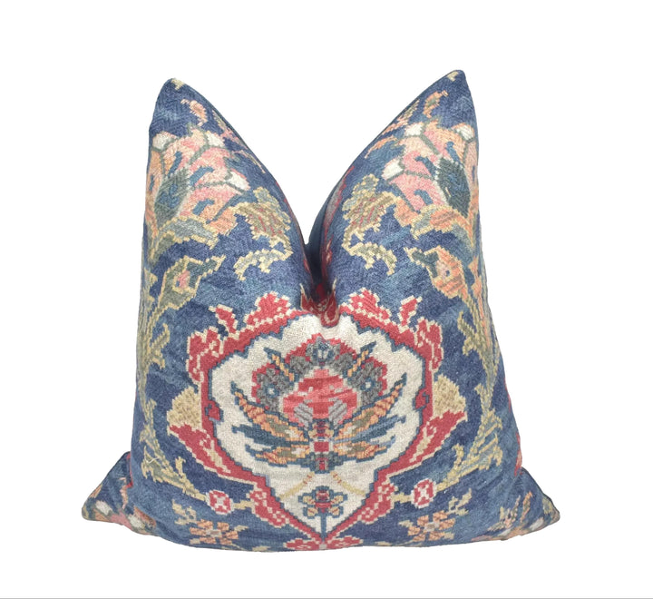 a decorative pillow with a vibrant, colorful floral pattern.