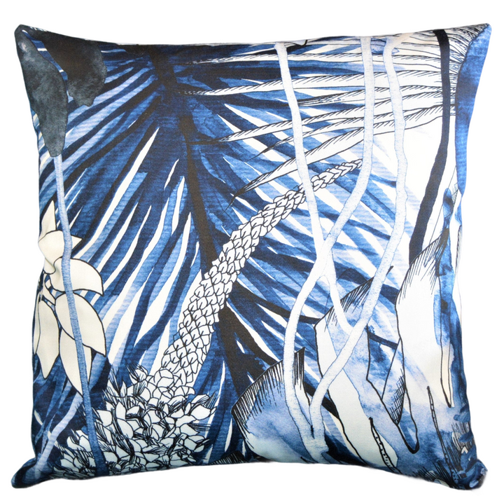 a blue and white pillow with a picture of a fish
