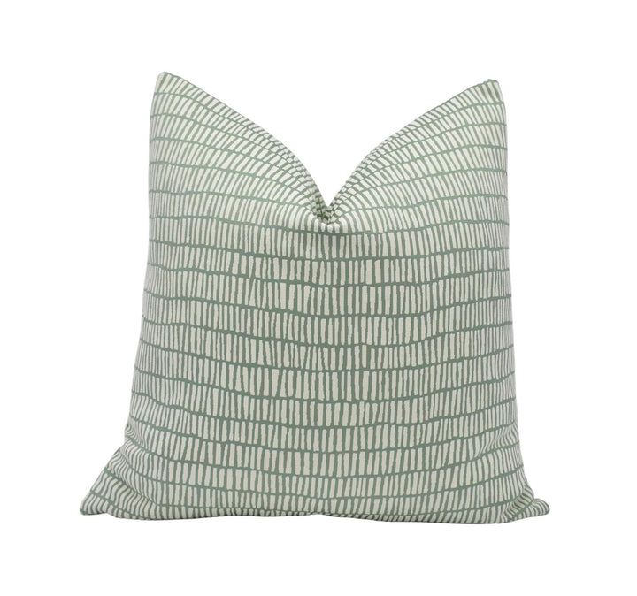 A single pillow with a repeating pattern of green and white stripes.