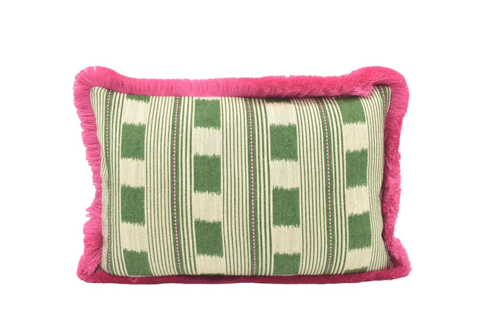 A decorative throw pillow with a green and white striped pattern and a pink fringe border.
