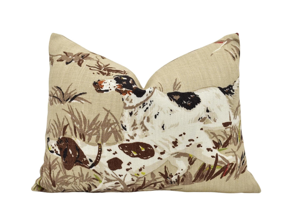 a pillow with a dog and bird on it