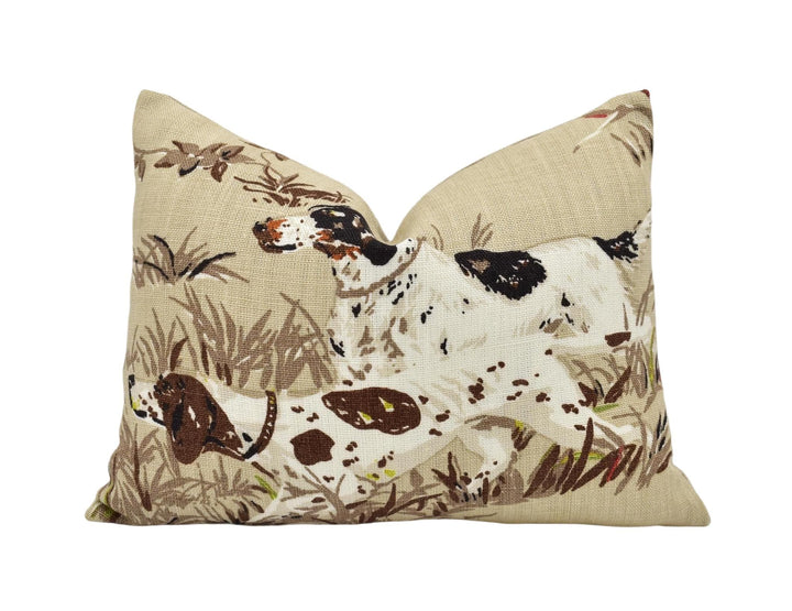 a pillow with a dog and bird on it