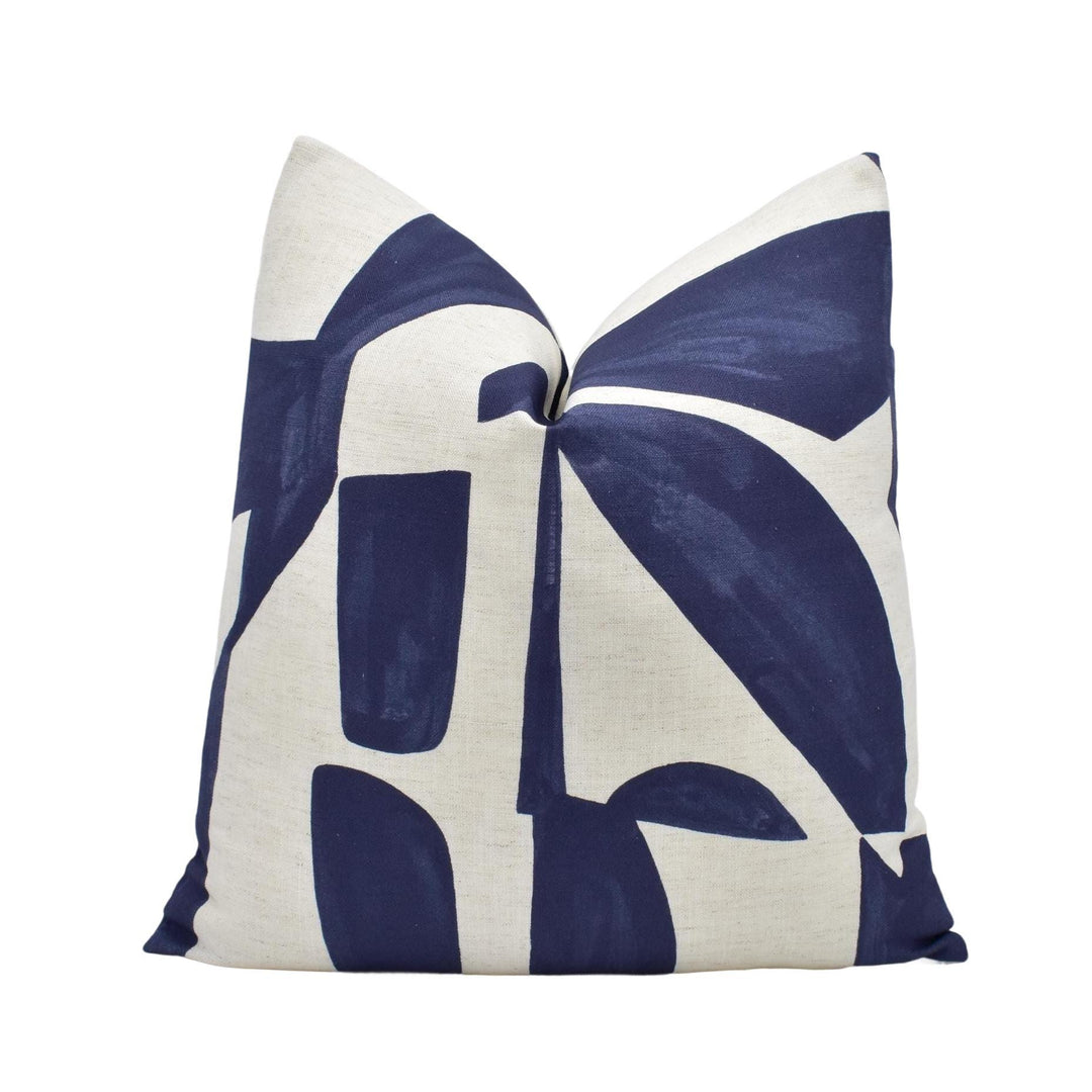 a blue and white pillow on a white background