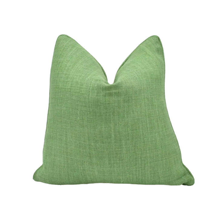 A green, textured throw pillow is shown against a white background.