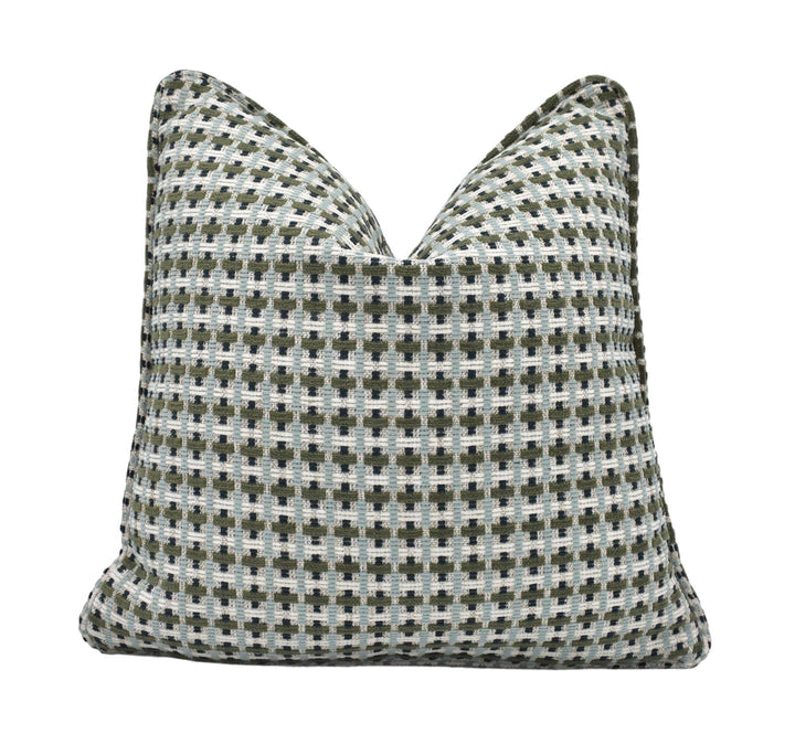 a black and white pillow on a white background