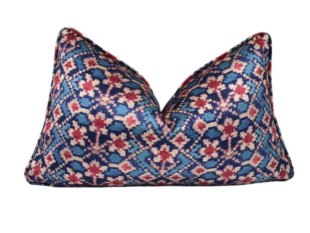 a blue and red pillow on a white background