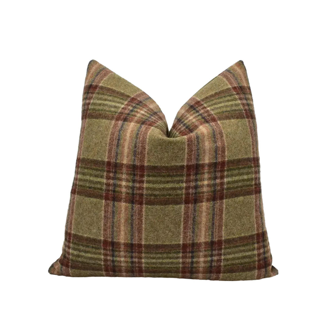 A single pillow with a plaid pattern in shades of brown and green.