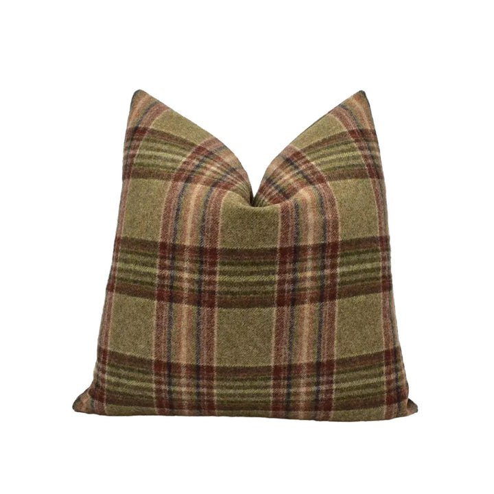 A single pillow with a plaid pattern in shades of brown and green.