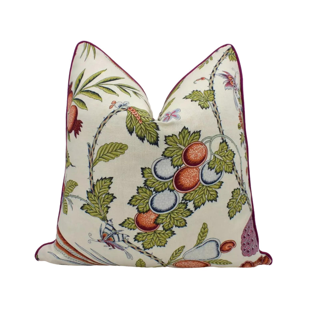 a decorative pillow with a floral pattern on a white background.