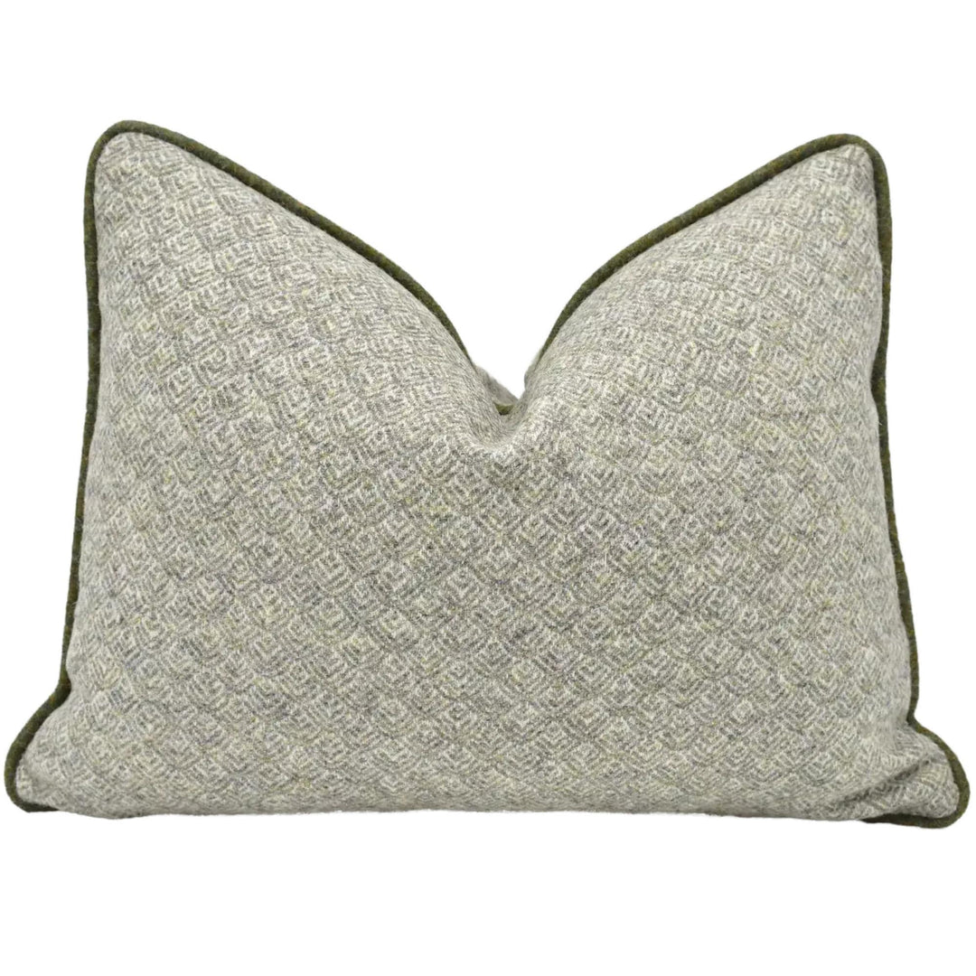 A gray and green patterned throw pillow with a textured, woven appearance.