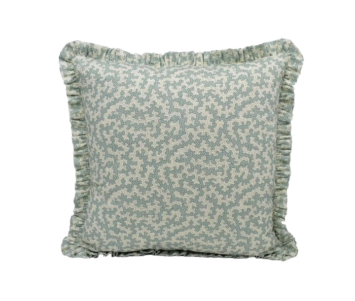 A square throw pillow with a light green floral pattern and a ruffled trim around the edges.