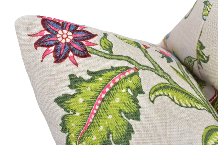 a close up of a pillow with a flower on it