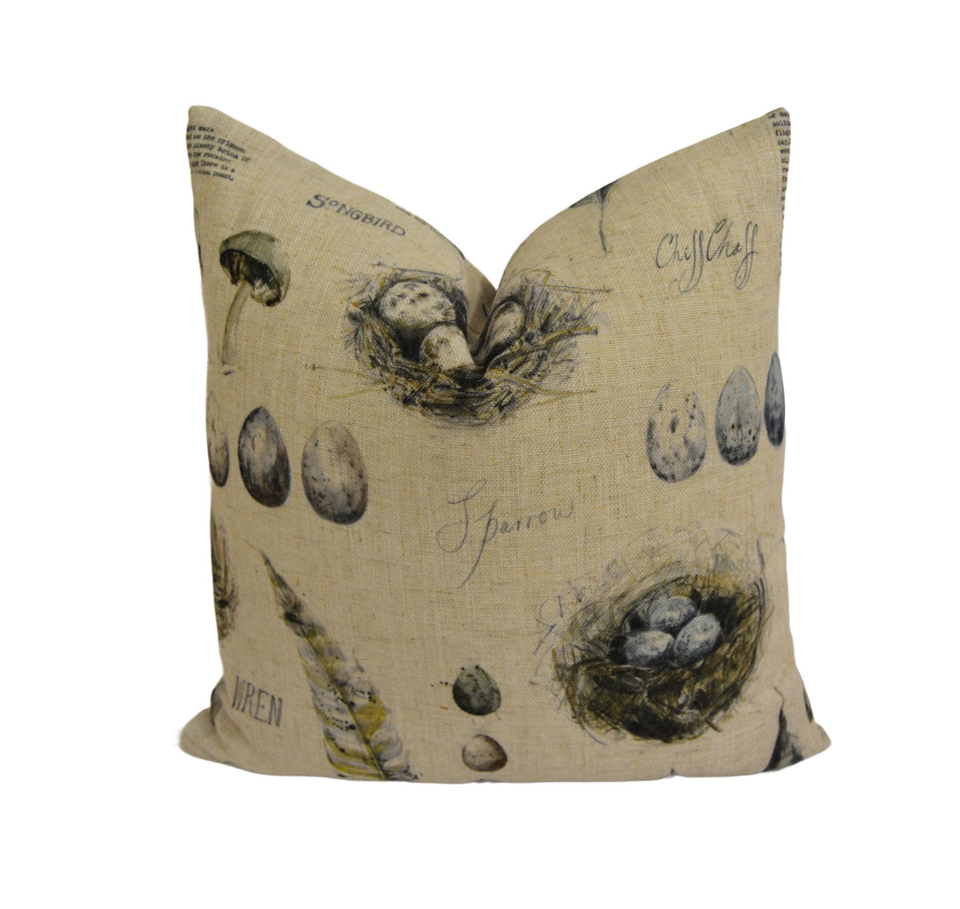 a pillow with a bird's nest on it