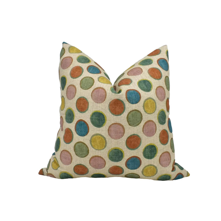 a single pillow with a colorful polka dot pattern.
