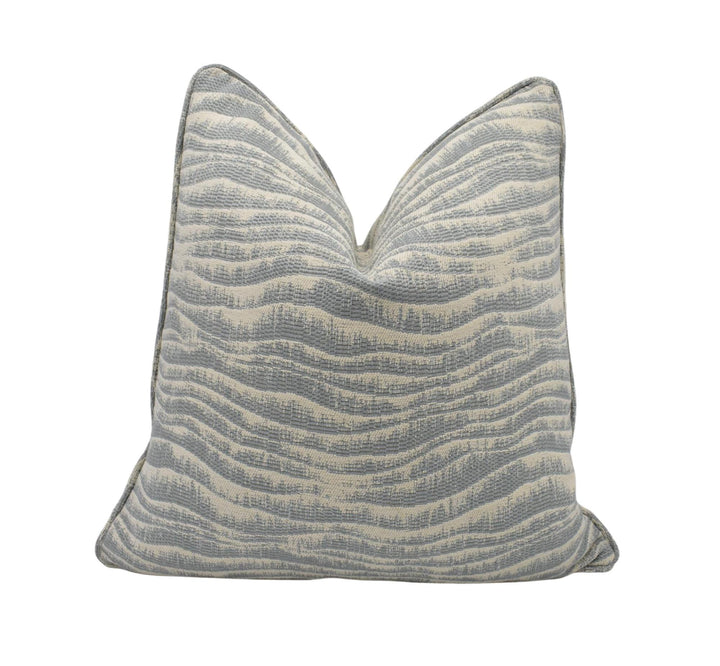 A gray and white striped throw pillow is shown against a white background.