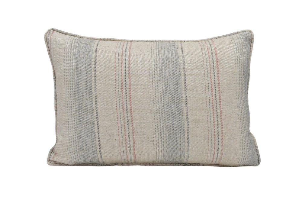 a striped pillow on a white background