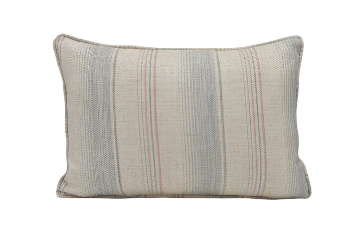 a striped pillow on a white background