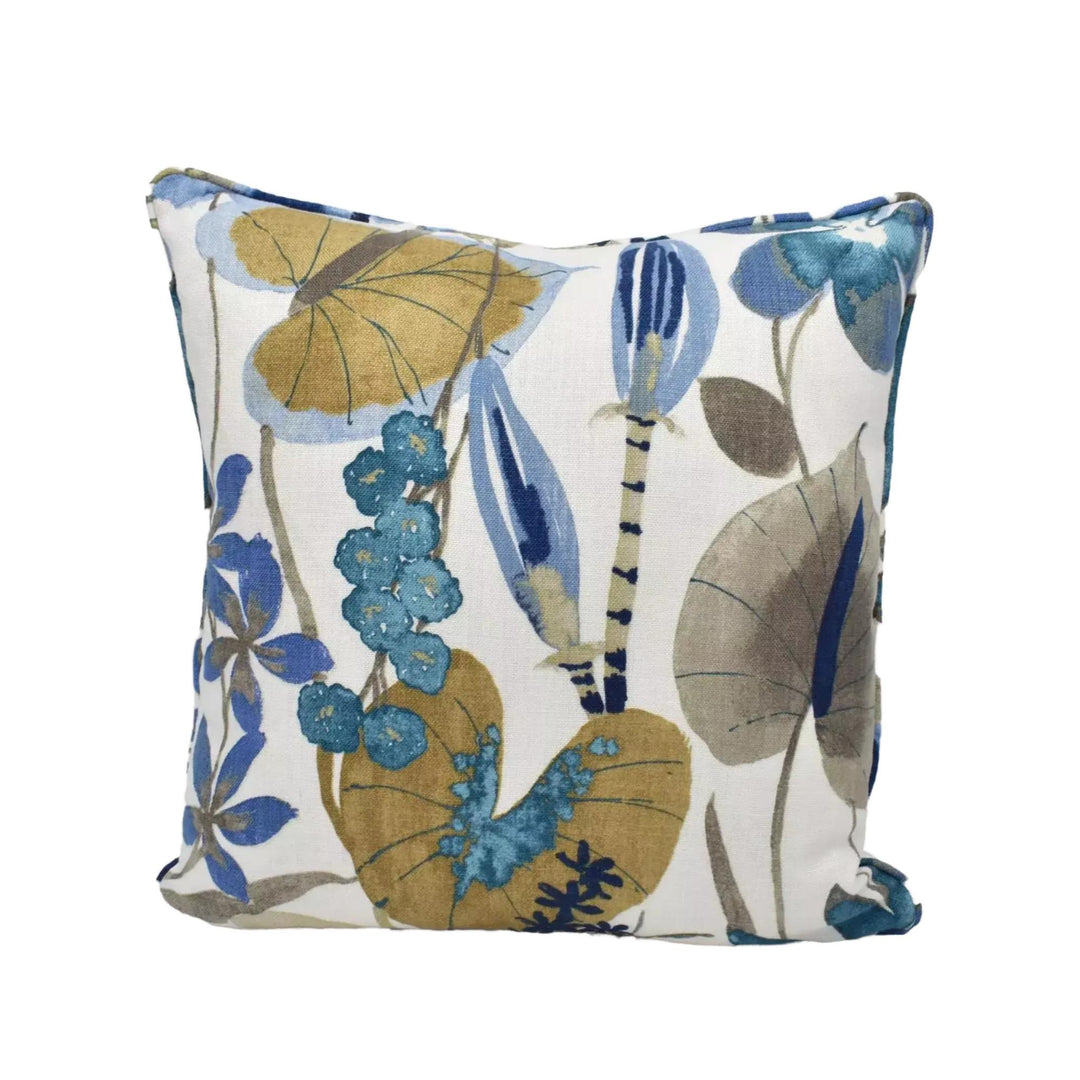 a square throw pillow with a floral print in shades of blue, green, and yellow.