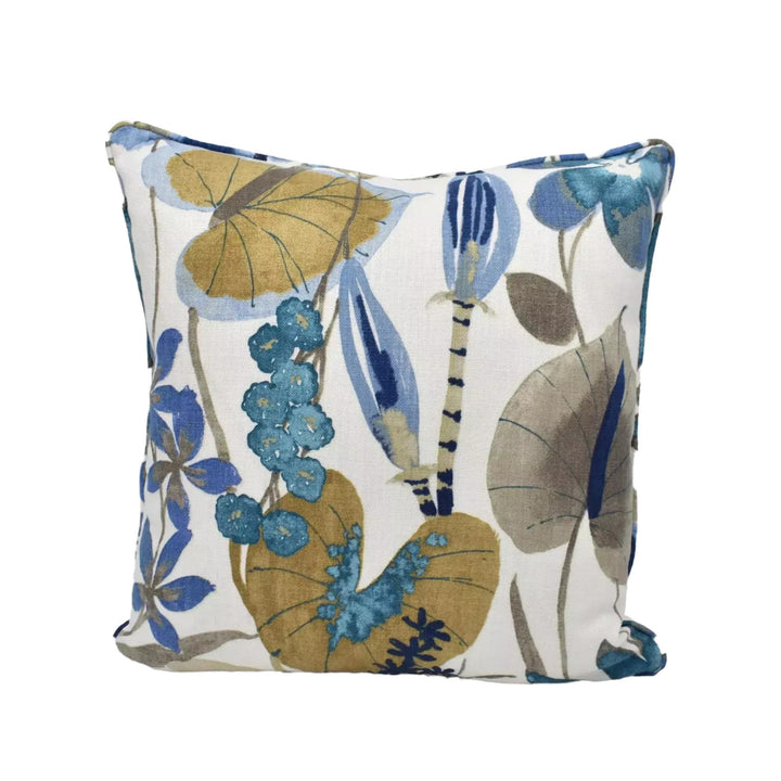 a square throw pillow with a floral print in shades of blue, green, and yellow.