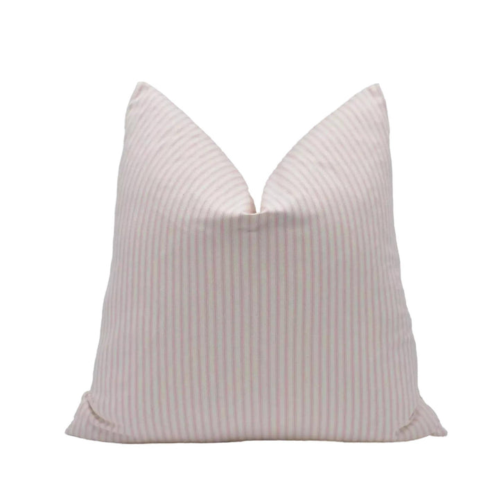 A single pillow with a striped pattern in shades of pink and white.